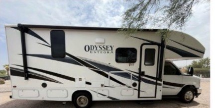 The Happy Pets Adventure RV, a 2025 Entegra Coach Odyssey 24B, parked outdoors
